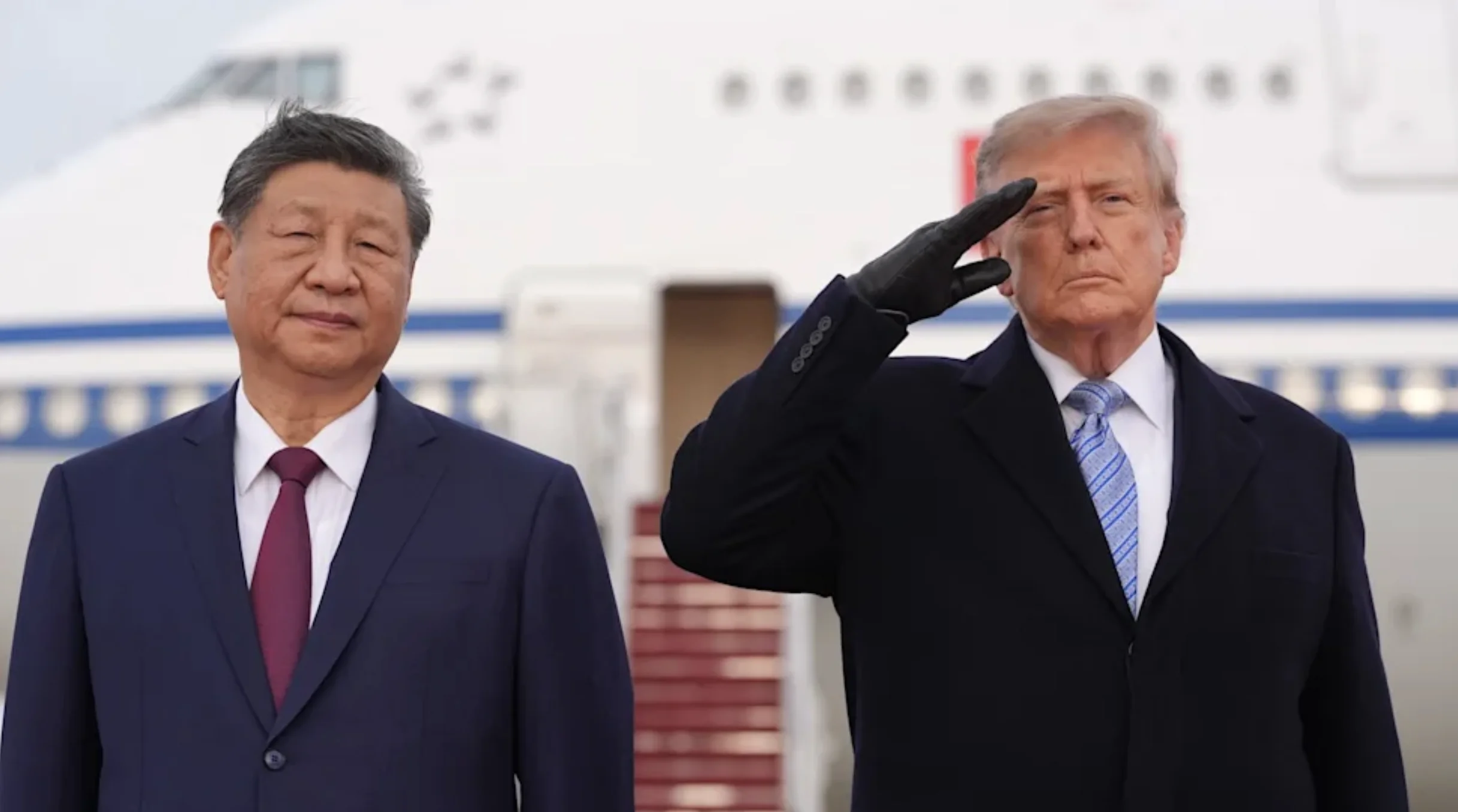Close crop of Donald Trump saluting in a black glove beside Xi Jinping, the detail scrutinised in the AI-retouching debate